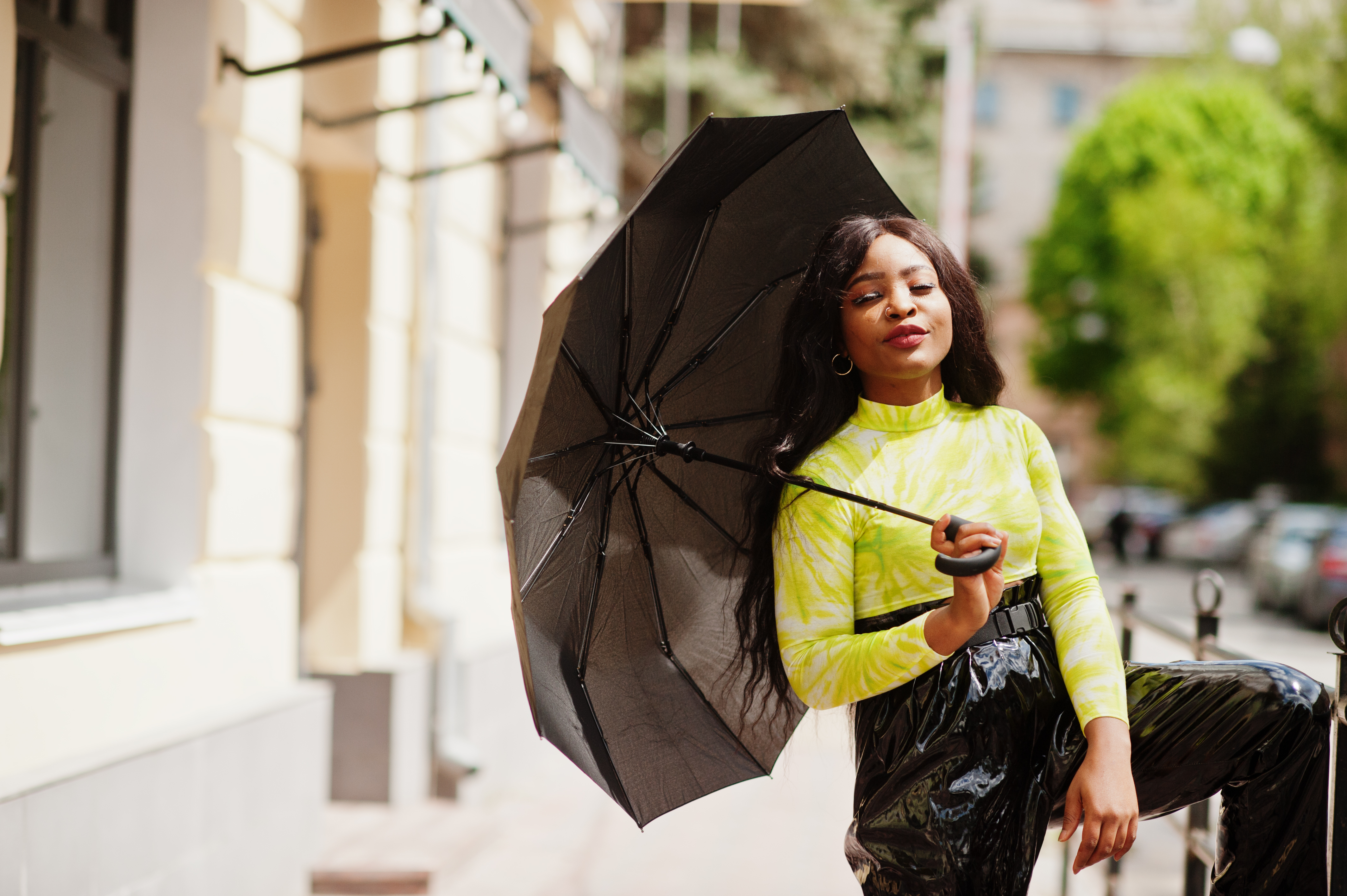 Happy lady holding an umbrella