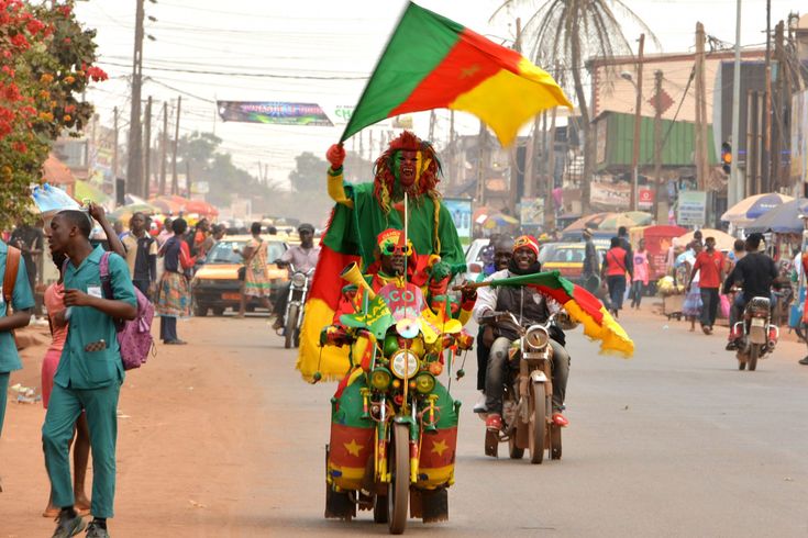 Cameroonian jubilating with the flag