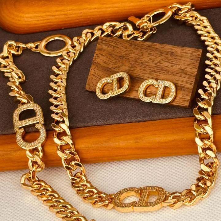 ensemble boucle et collier doré CD