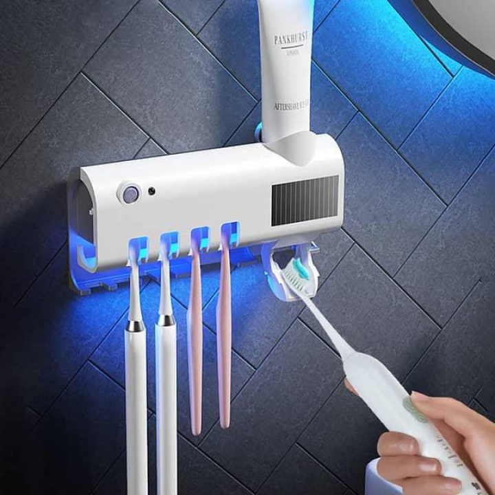 Stérilisateur de brosse à dent avec distributeurs de dentifrice