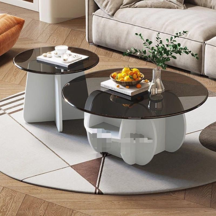 2 glass tables with sleek, transparent surface and a modern design.
