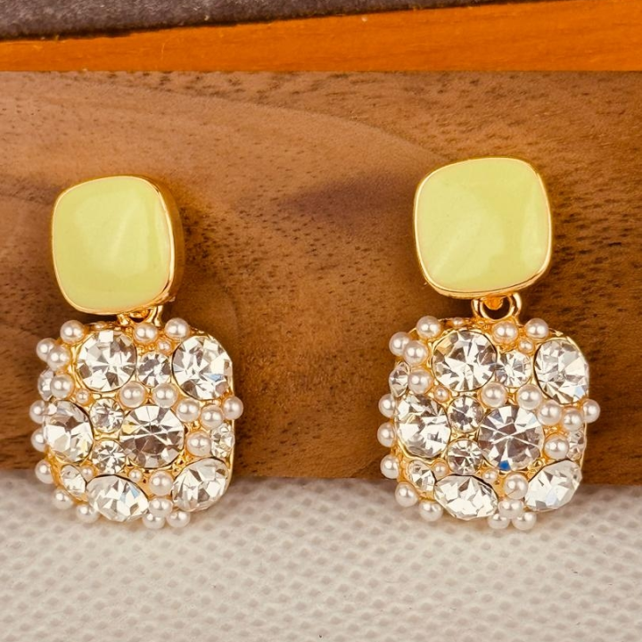 boucle doré avec pendentif jaune et transparent