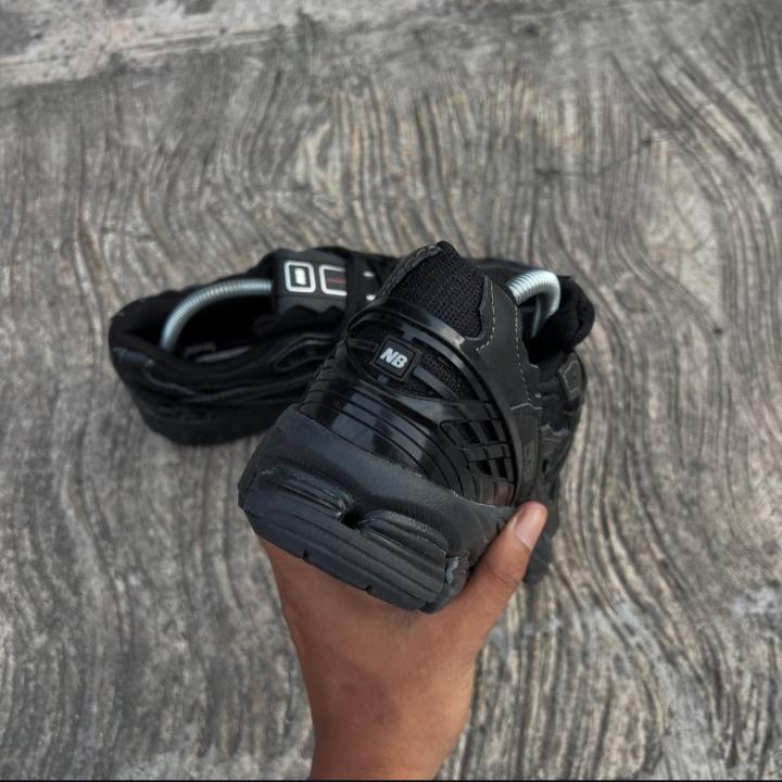 All black New balance 1906D